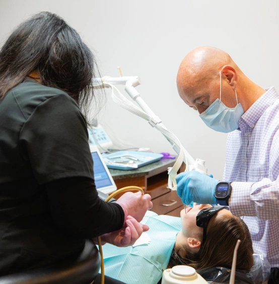 Dr. Daniel L. W. Fishel providing emergency orthodontic care to a patient