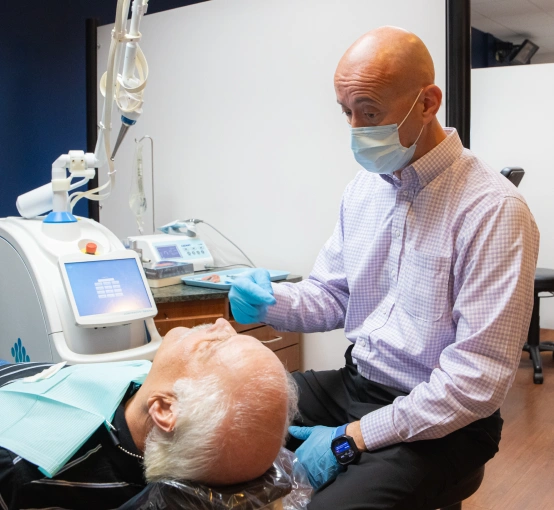 Dr. Daniel L. W. Fishel treating a new patient at F&S Orthodontics & Periodontics